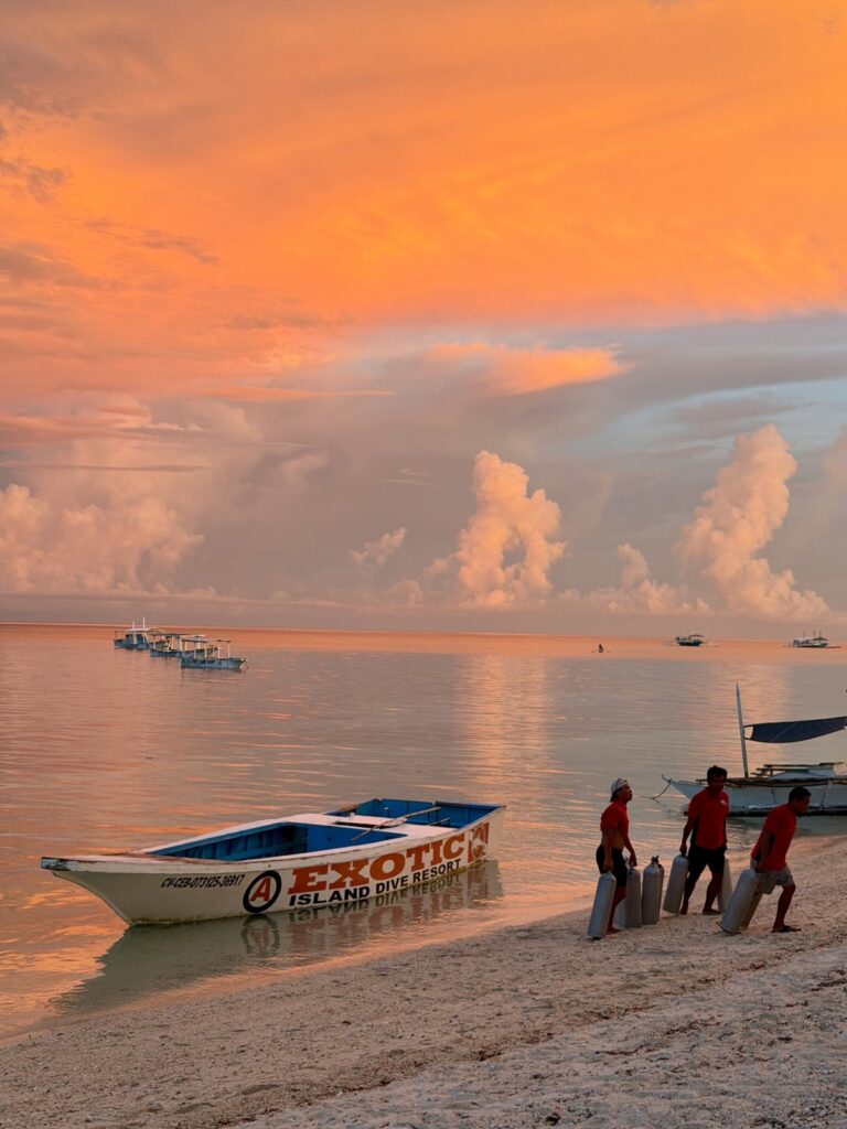 Diving Malapascua Island - sunset over dive boats and beach