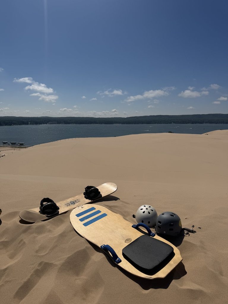 Sandboarding gear at Silver Lake Sand Dunes on our Lake Michigan road trip